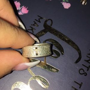 Textured silver band with gold cross